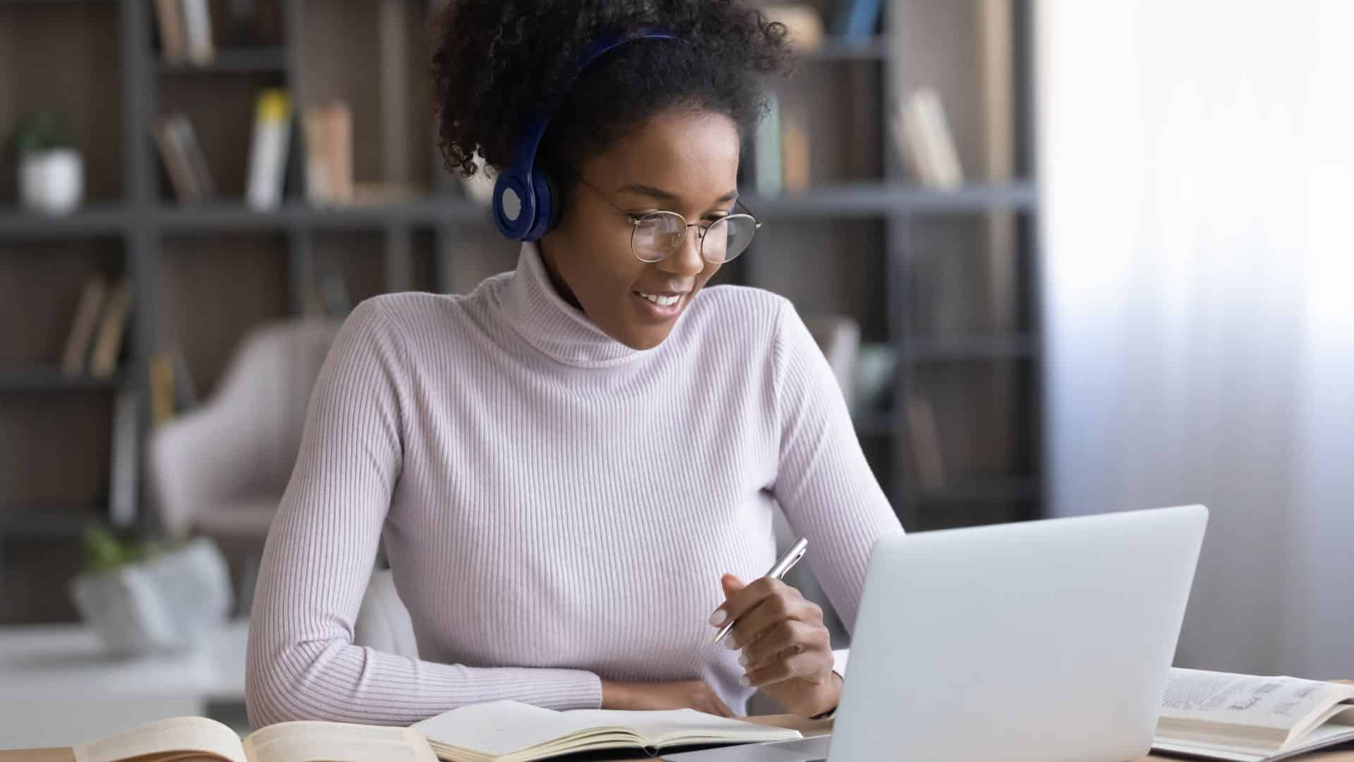 Person using laptop for a conference call.