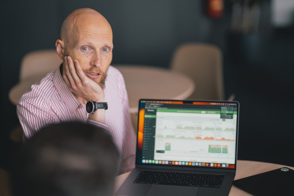 A man exploring DeskTime dashboard